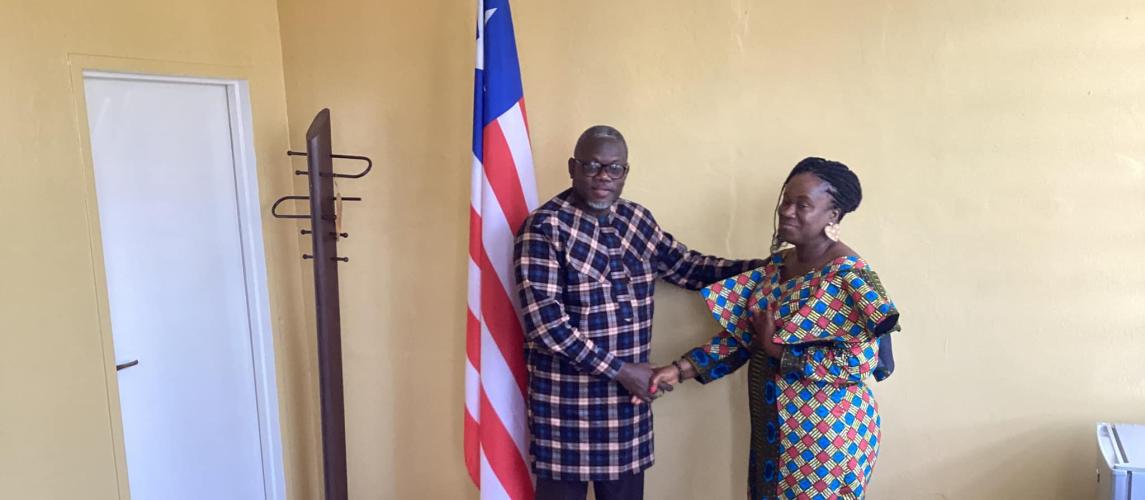 Hon. Jerolinmek Piah and Princess Fatu Gayflor exchange a handshake."